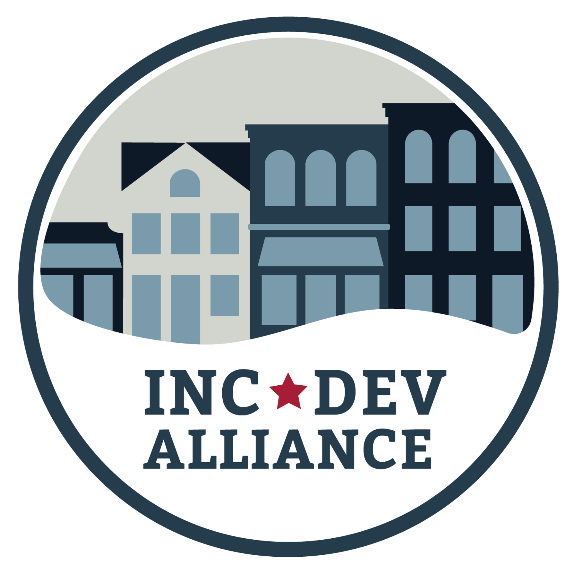 A circular logo featuring stylized blue and gray buildings above the words 'INC DEV ALLIANCE' with a small red star between 'INC' and 'DEV', on a white background.
